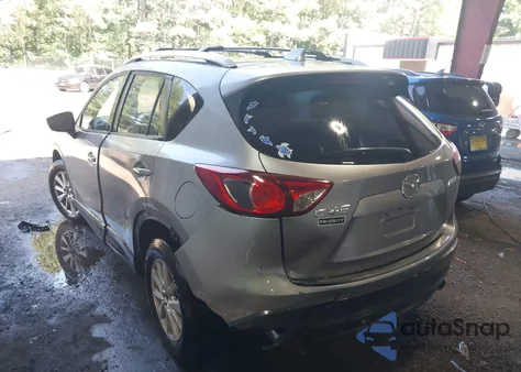 2014 Mazda Cx-5 Touring z USA, uszkodzony, nr VIN JM3KE2CY7E0317859